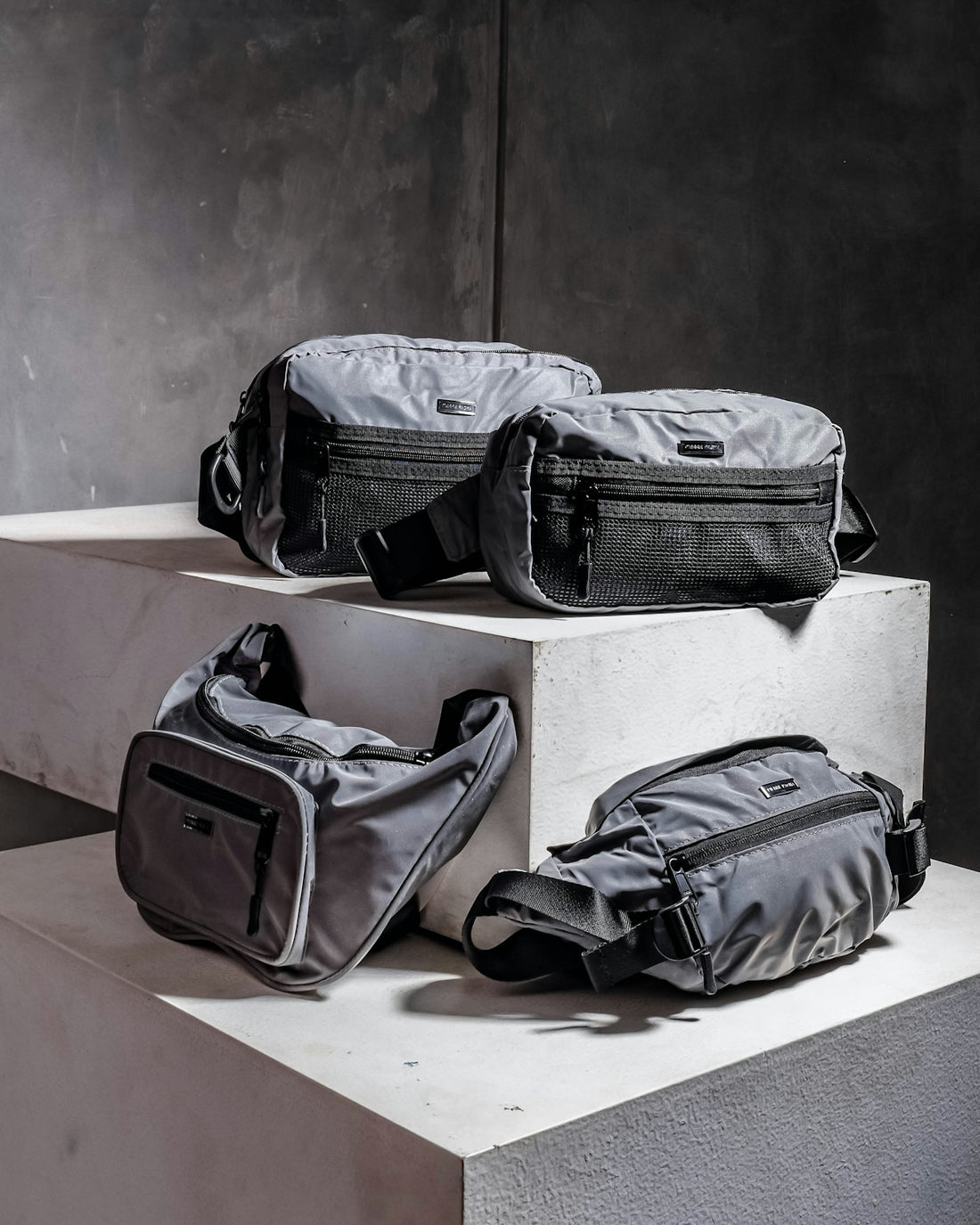 a couple of bags sitting on top of a cement block