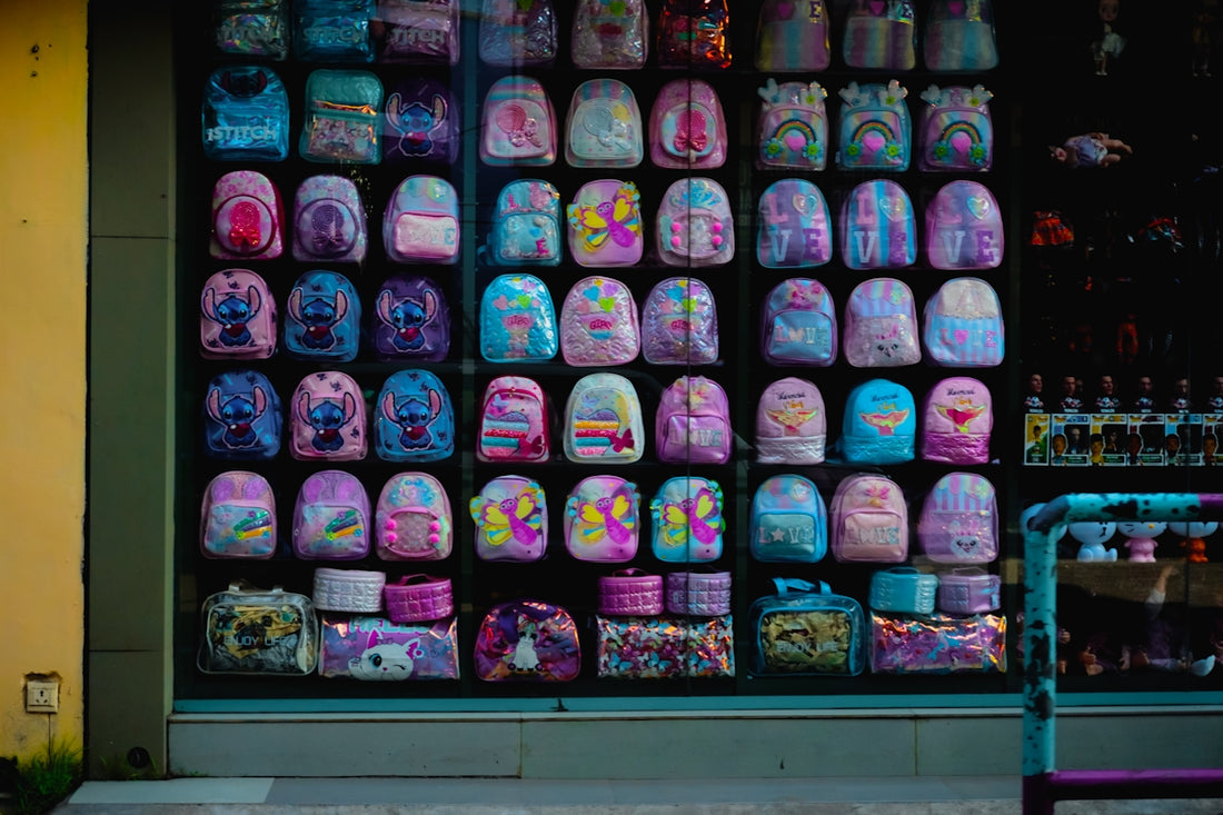 Colorful backpacks displayed in a shop window