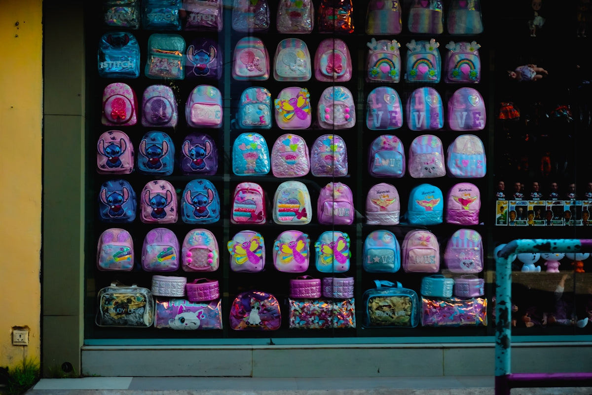 Colorful backpacks displayed in a shop window
